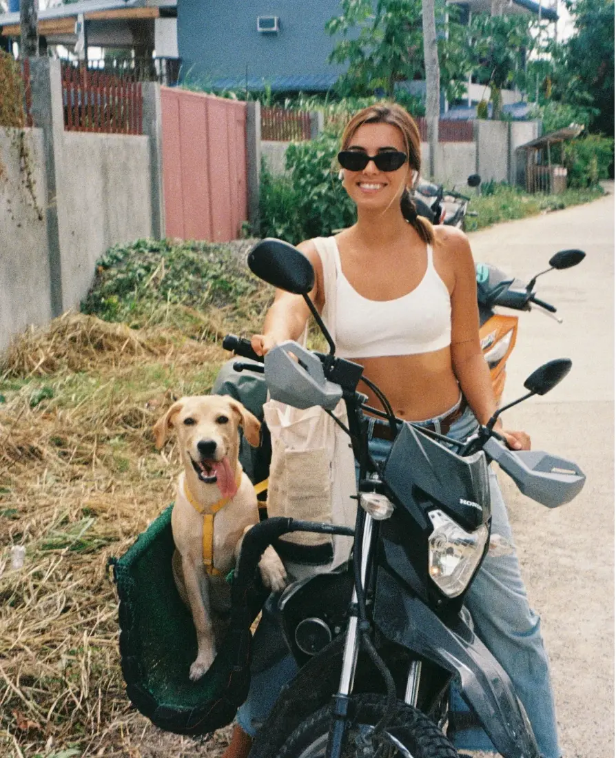 Ari with her dog on a motorbike